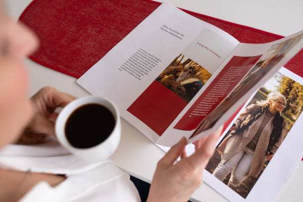 istock Woman reading a magazine at home 2080911024