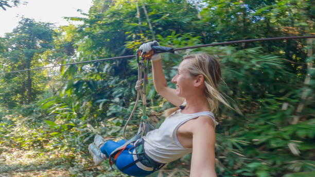 istock Jungle Flight: A Young Woman's Adventure Zip-Lining in Laos 2080912601
