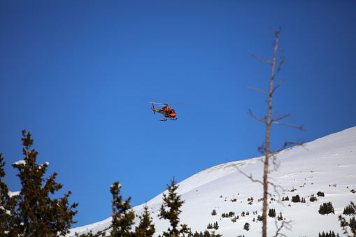 Flight for life searching for someone after an avalanche