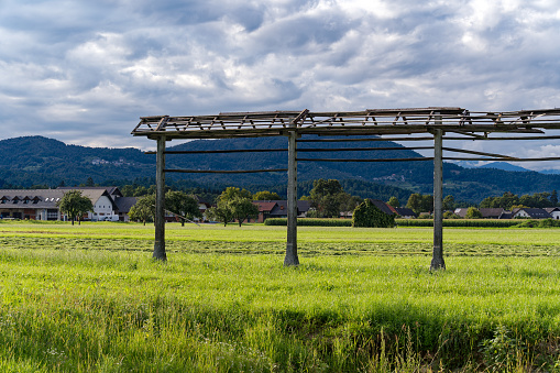 Hayrack at farmland at village of Zabnica on a cloudy summer evening. Photo taken August 10th, 2023, Zabnica, Kranj, Slovenia.