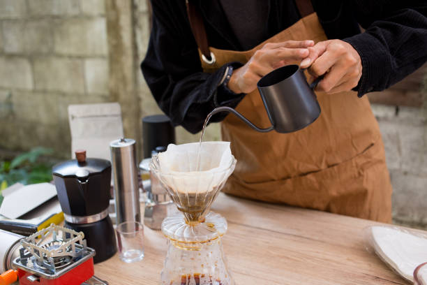 istock Man making coffee for dripping hot coffee into the cup with equipment, tool brewing at kitchen home 2080938289
