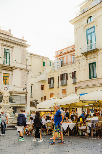 September 24, 2024: Walking the old streets with traditional cliffside buildings during summer season in Amalfi, Naples region, South Italy