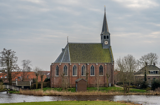 Scenery with dutch reformed church in the village of West-Graftdijk