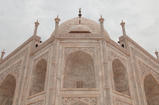 Taj Mahal ivory-white marble mausoleum Best Example of Mughal architecture in 17th Century with a blend of Indian, Persian, and Islamic styles. It is a symbolic of Paradise ordered by the Mughal Emperor Shah Jahan in Memory of his favourite wife. The Taj Mahal is an Islamic Religious building, mosque and tomb in India, as well as being an exquisite marble structure in City of Agra, India.