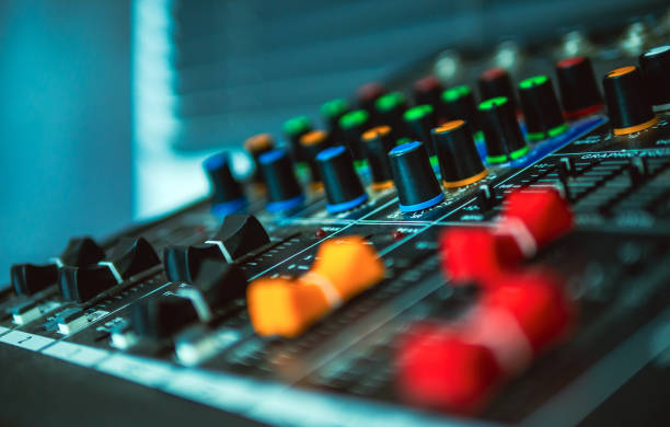 istock Close-up of sound recording equipment knobs.Mixer control. Music engineer. Backstage controls on an audio mixer, Sound mixer. Professional audio mixing console, buttons, faders and sliders. sound check. 2080983656