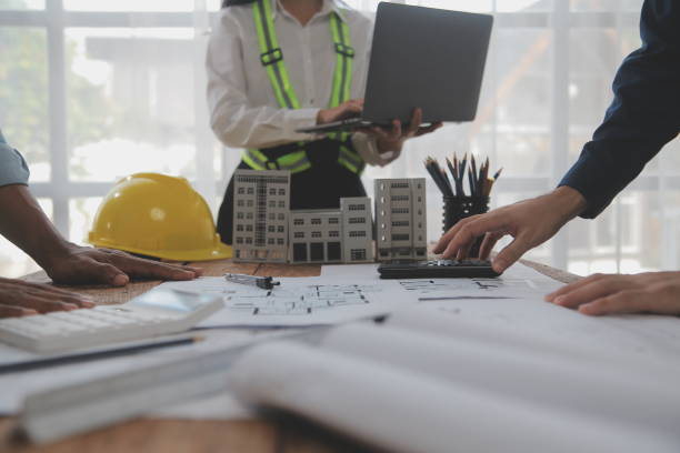 istock Construction and structure concept of Engineer or architect meeting for project working with partner and engineering tools on model building and blueprint in working site, contract for both companies. 2081038398