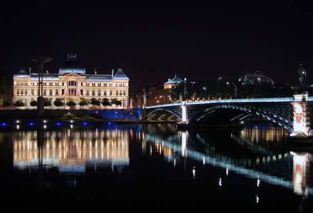 Lyon, France at night with the Cathedrale Saint-Jean-Baptiste and the Basilica of Notre Dame of Fourviere