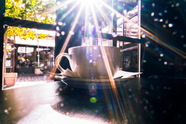 Cup of tea on breakfast table by the window on sunny spring morning
