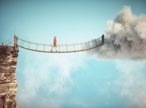 Man walking on a rope suspension bridge. Travel concept. This is a 3d render illustration.