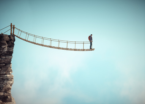 Surreal scene with a rope bridge cut in half suggesting the concept of dead end or impossible situation. THIS IS A 3D RENDER ILLUSTRATION.
