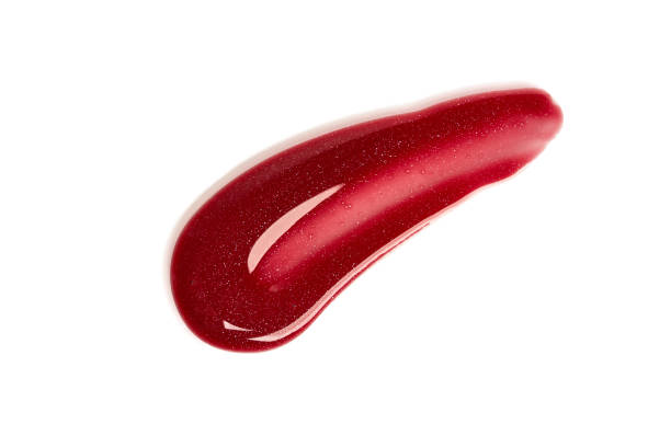 istock Lip gloss sample isolated on white. Smudged red lip gloss. Makeup product sample. 2081097241
