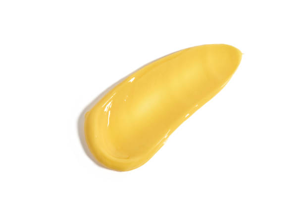 istock Yellow mask cream cosmetic swatch texture isolated on white background 2081097479