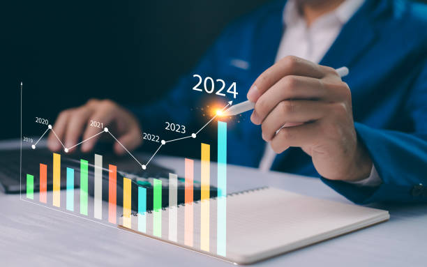 istock Businessman interacts with a graph showcasing growth, year 2024 upward trend, symbolizing optimistic business forecasting and strategic planning. Calculates financial data for long-term investments. 2081107976