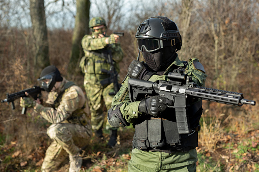 Military soldier holds a radio station, and give orders subdivision