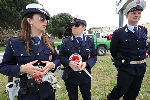 Italian Municipal Police with their patrols and cars direct traffic in the city, intervene in traffic accidents, and issue fines and penalties to motorists who do not obey traffic laws.