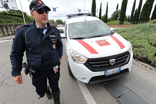 Titusville, Florida, USA - May 30, 2020: A couple waits in their vehicle as a City of Titusville police car blocks their access at an accident scene.