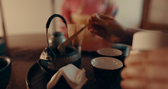 Traditional, matcha and Japanese women with tea for culture with leaves and powder in tearoom. Friends, ceremony and people with herbal beverage for wellness, mindfulness or detox for drinking ritual