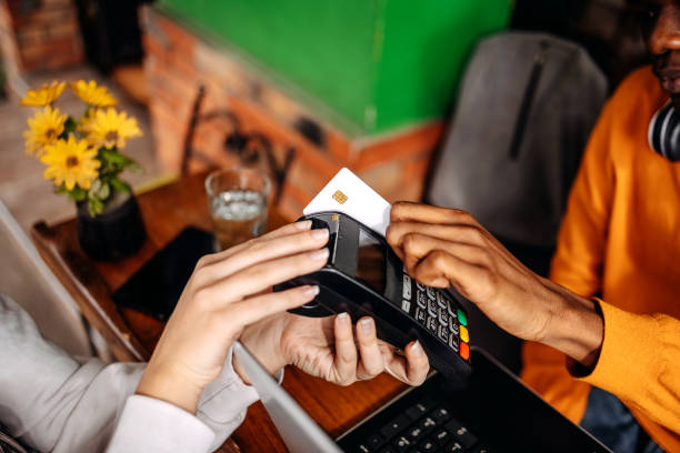 istock People paying bill in cafe using credit card 2081151350