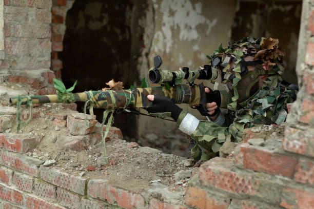 A sniper hiding in an urban development shoots