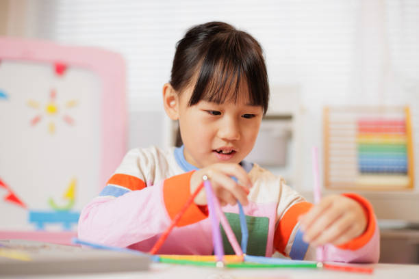 istock young girl playing Construction toys at home 2081222474