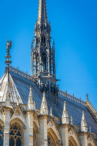 Apse and spire of the Sainte-Chapelle church on sunny day in Paris, France