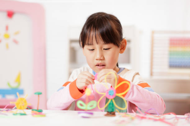 istock young girl making craft at home 2081224677