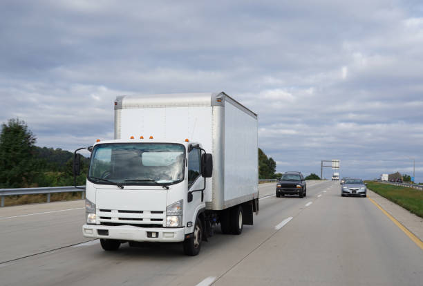 istock White cab-over light duty truck on highway delivering goods 2081233767