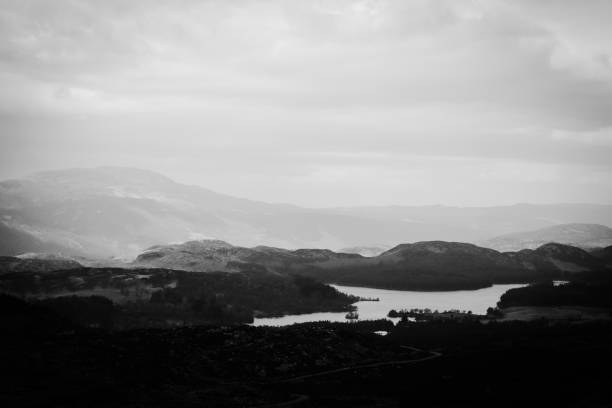 View over the Scottish Highlands, with mountain ranges and a distant loch