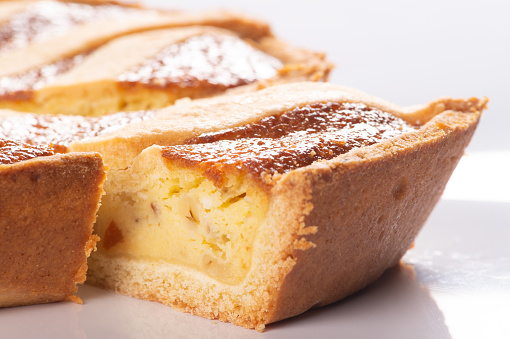 Pastiera napoletana is a typical Easter sweet cake of the area of southern Italy in the Campania region on white background