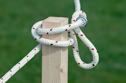 Knotted Rope On Wooden Post In A Park