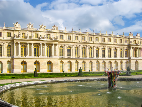 Paris, France - April 2016: Versailles palace and gardens in spring outside Paris