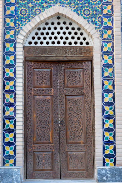 istock closed door in a wall of different pattern 2081316450