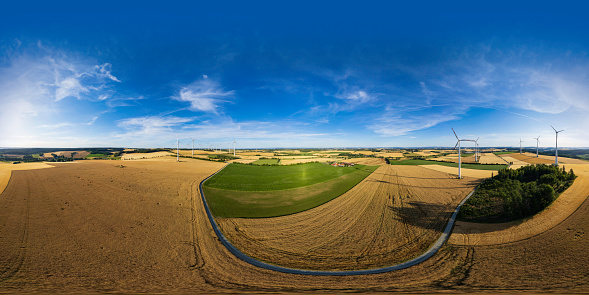360 degrees spherical panoramic shot of wind turbines in a rural landscape