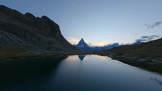 Aerial view of Matterhorn mountain and glacial lagoon at sunrise, Swiss Alps