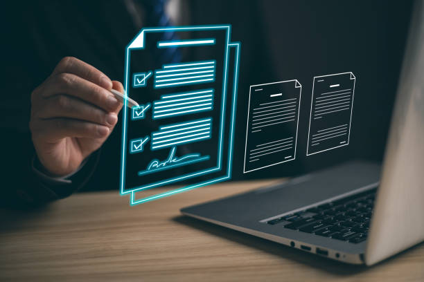 istock businessman sign digital documents online in the office, Document Management System (DMS), knowledge and documentation in enterprise with ERP, electronic signature. Paperless workplace concept. 2081333575