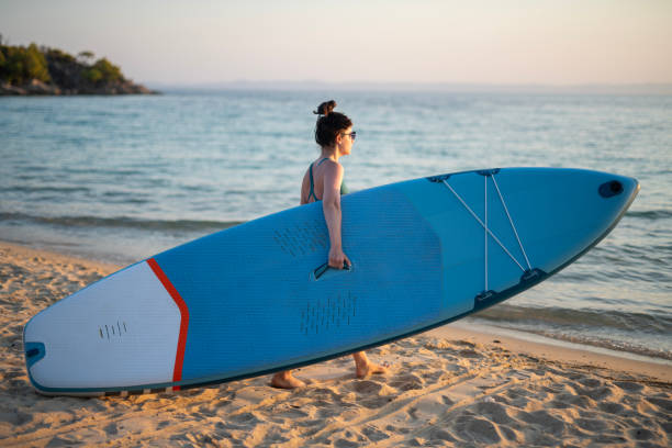 istock Woman paddleboarding on a summer vacation. 2081347982