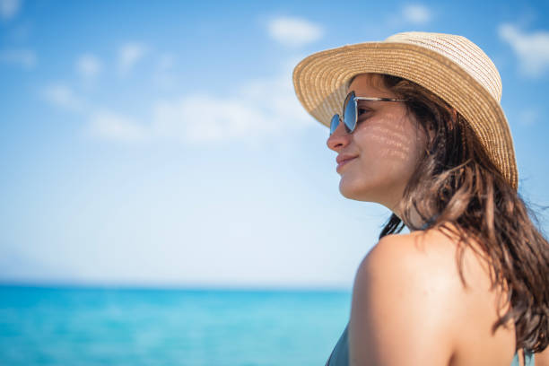 Young woman enjoying her summer holiday on the beach.