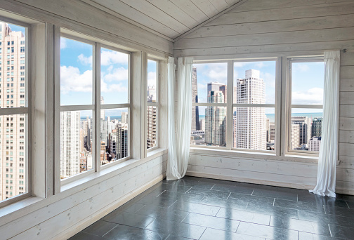 Empty modern room with large window with image montaged  urban view