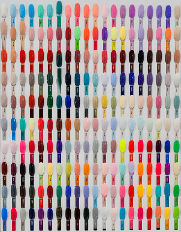 Nail polish samples of different bright colors on a white background