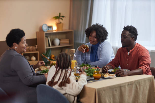 istock Three Generation Family Eating Dinner Together 2081375346