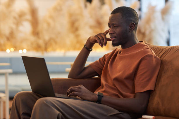 istock Black Man using Laptop at Office Or Coworking Space 2081387277