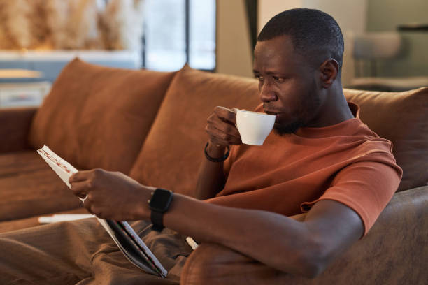 istock Black Man Enjoying Cup of Coffee in Cafe 2081387304