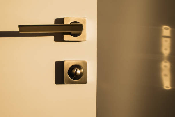 istock Door with metallic handle in warm light, modern interior 2081399700