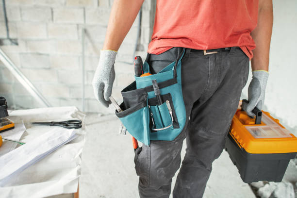 istock Worker at a construction site with tools during an apartment or a house reconstruction, renovation or repair 2081430541