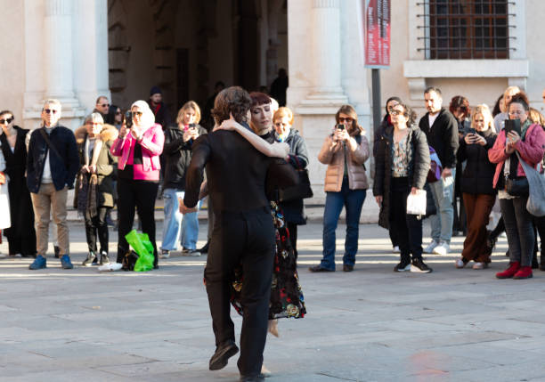 Pair of ballet dancers performing in a piazza in Verona as part of the Valentines day celebrations in the town.