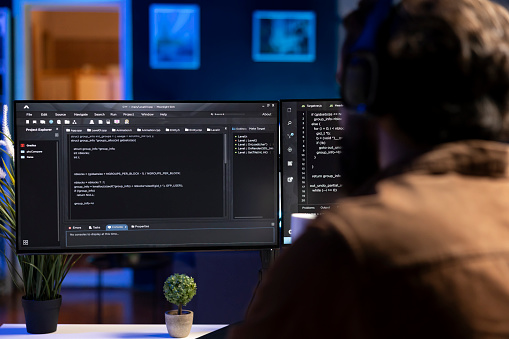 screen captured while programmer modifies source code... Man Doing Software Quality Assurance Reading Source Code On Computer ...
