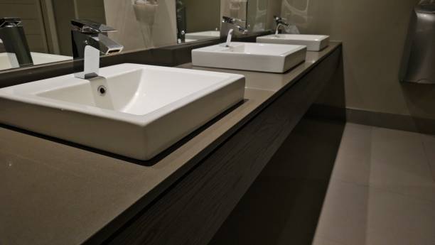 istock Modern sinks with mirror in public toilet concept 2081468582