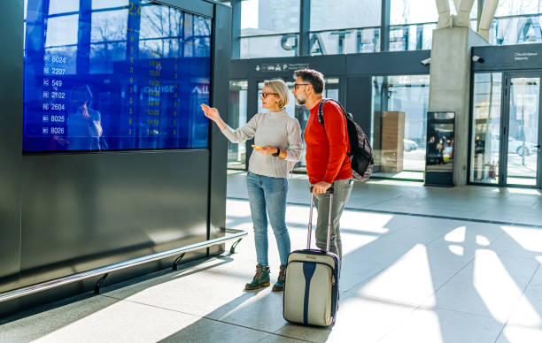 istock Mature couple looking at the information board 2081475123