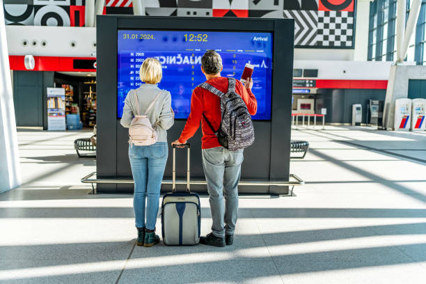istock Mature couple checking the information board 2081483783