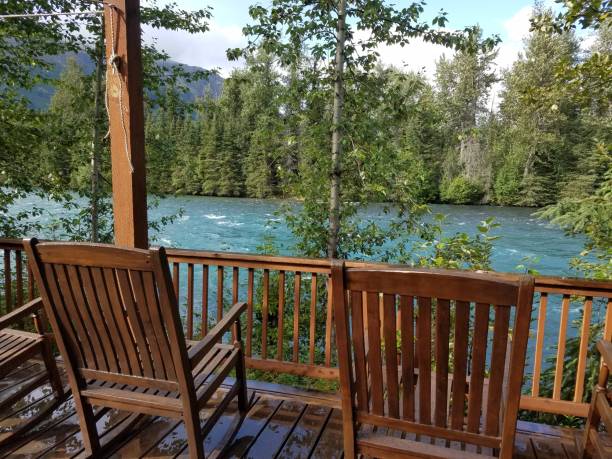 istock Relaxing view of river from wooden deck 2081599989